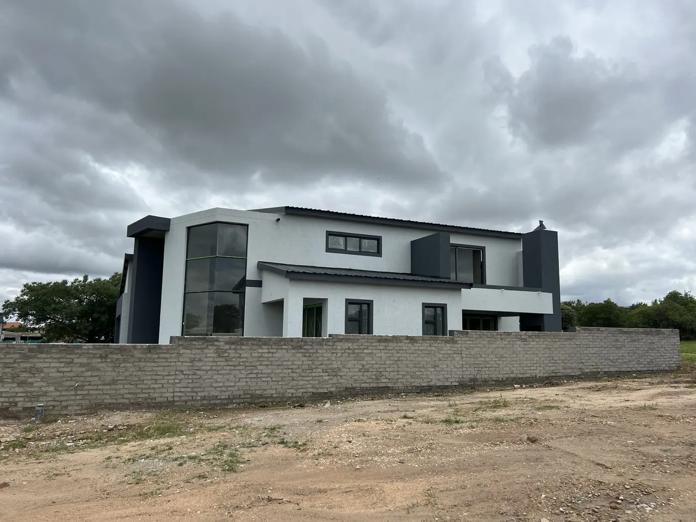 Double-storey home with a curved facade completed by Ntoampe 0207 Properties in Limpopo