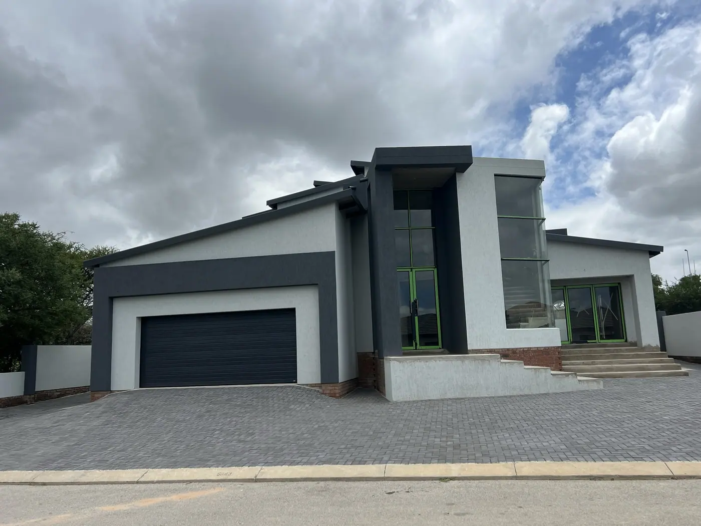 Completed modern home with dark plaster and glazing, Polokwane